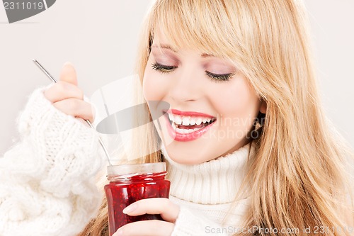 Image of happy teenage girl with raspberry jam