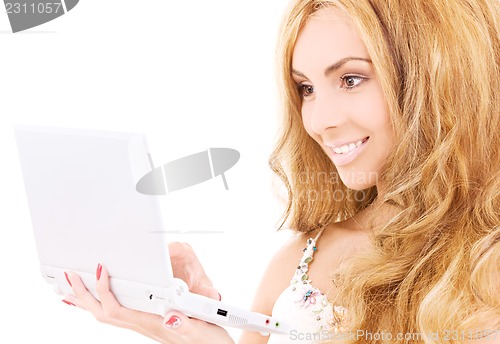 Image of happy woman with laptop computer