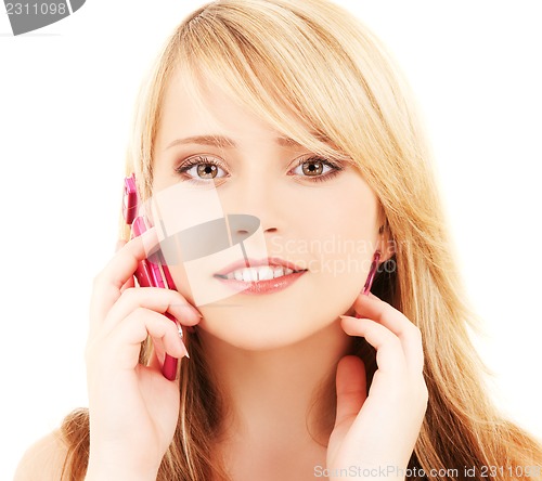 Image of happy girl with pink phone