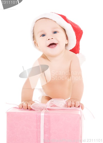 Image of santa helper baby with christmas gift