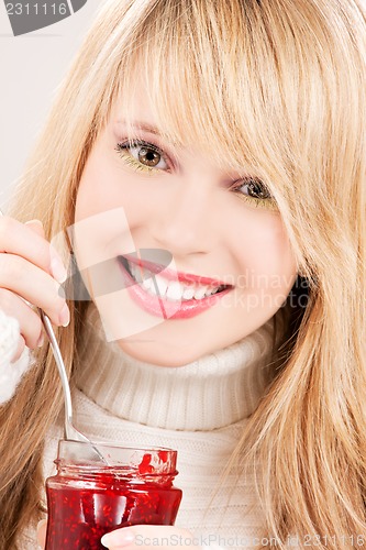 Image of happy teenage girl with raspberry jam