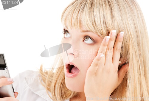 Image of surprised woman with cell phone