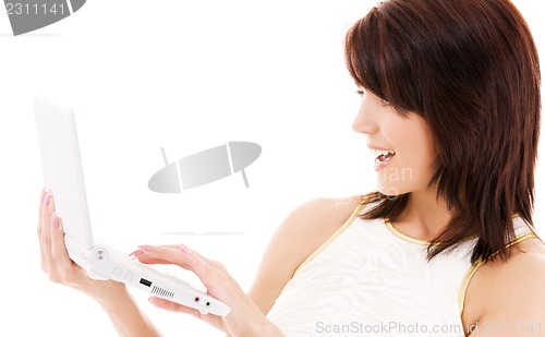 Image of happy woman with laptop computer