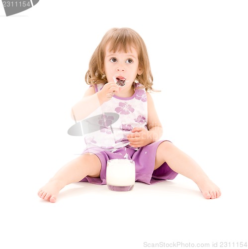 Image of little girl with yogurt