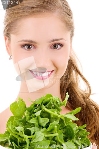 Image of happy woman with spinach