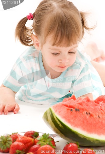 Image of little girl with strawberry and watermelon