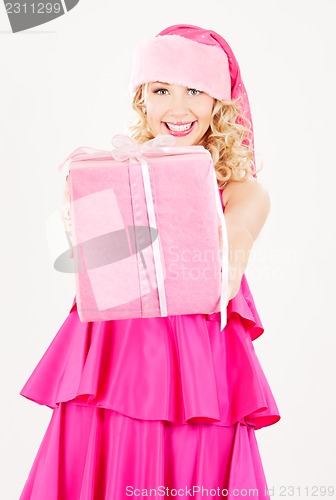 Image of cheerful santa helper girl with gift box