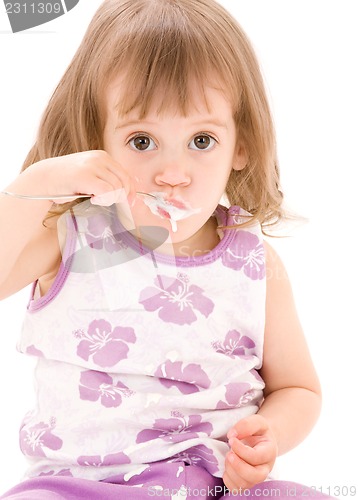 Image of little girl with yogurt