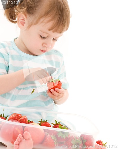 Image of little girl with strawberry