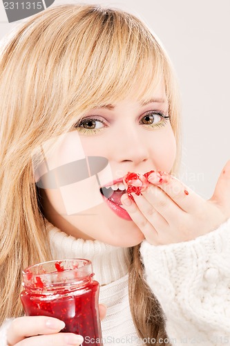 Image of happy teenage girl with raspberry jam