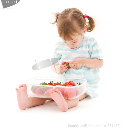 Image of little girl with strawberry