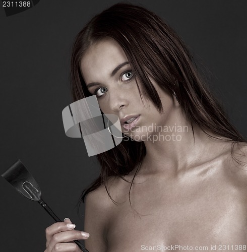 Image of woman with riding crop
