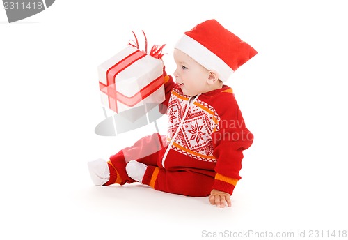 Image of santa helper baby with christmas gift