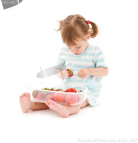 Image of little girl with strawberry