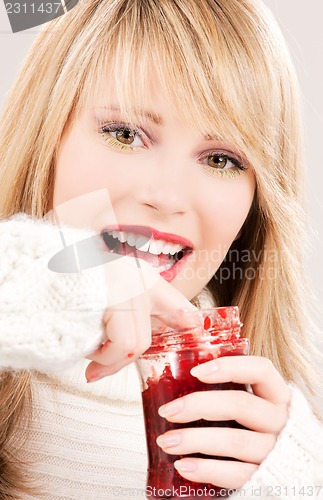 Image of happy teenage girl with raspberry jam