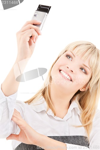 Image of happy woman using phone camera