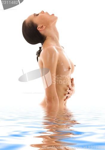 Image of topless girl in blue water