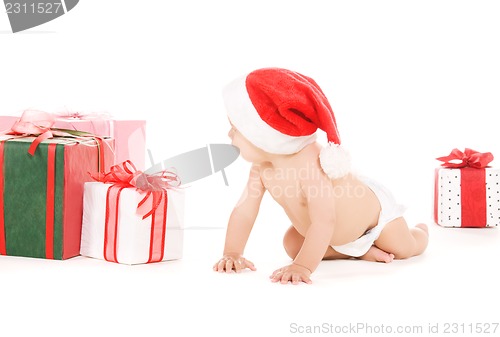 Image of santa helper baby with christmas gifts