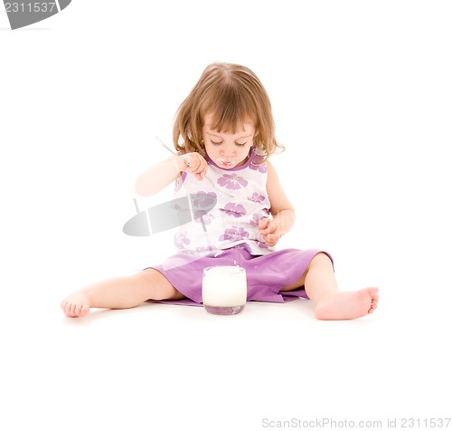 Image of little girl with yogurt