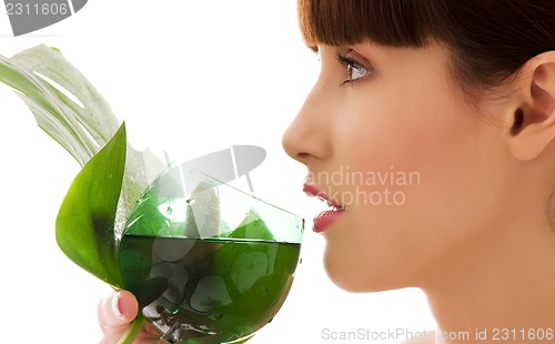 Image of woman with green leaf and glass of water