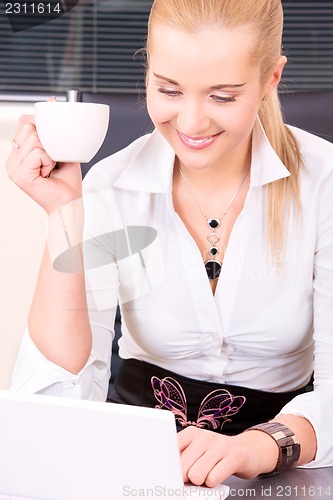 Image of happy businesswoman with laptop computer