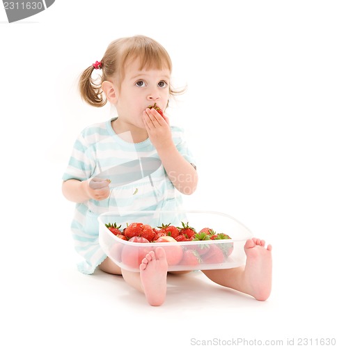 Image of little girl with strawberry