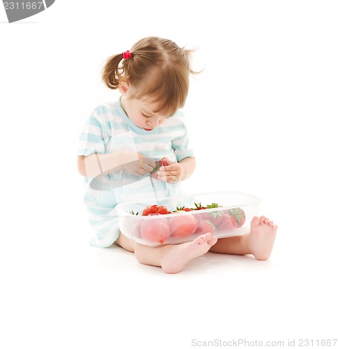 Image of little girl with strawberry
