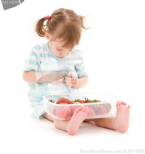 Image of little girl with strawberry