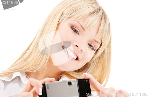 Image of happy woman using phone camera