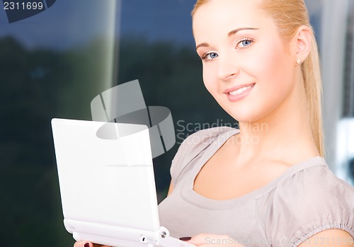 Image of happy businesswoman with laptop computer