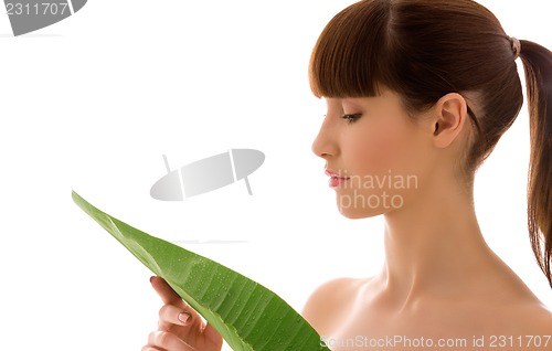 Image of woman with green leaf