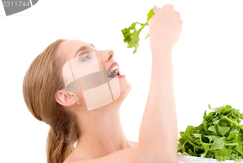 Image of happy woman with spinach