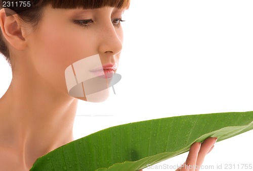 Image of woman with green leaf