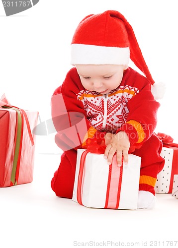 Image of santa helper baby with christmas gifts