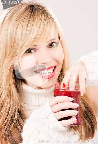 Image of happy teenage girl with raspberry jam