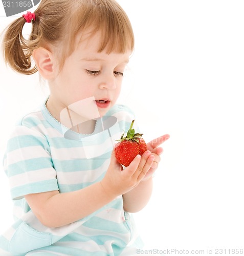 Image of little girl with strawberry