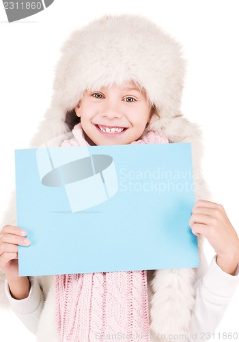 Image of girl in winter hat with blank board