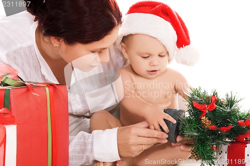 Image of baby and mother with christmas gifts