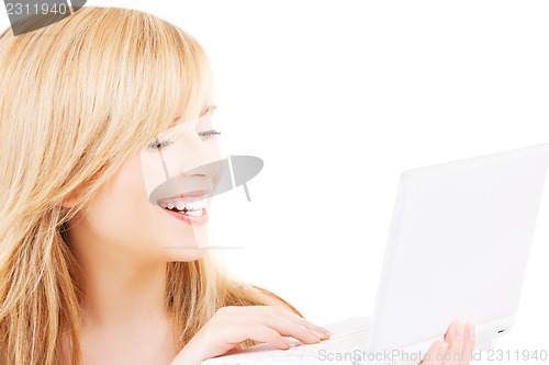 Image of teenage girl with laptop computer