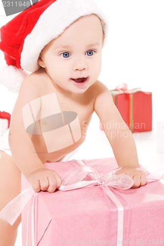 Image of santa helper baby with christmas gifts