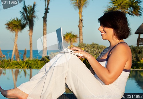Image of lovely woman with laptop computer
