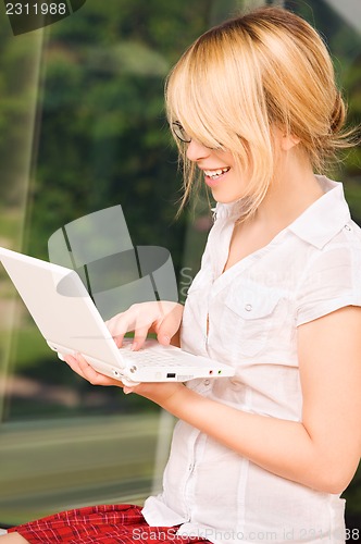 Image of office girl with laptop computer