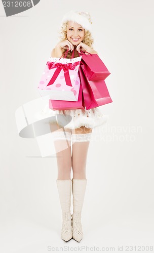 Image of santa helper with pink shopping bags