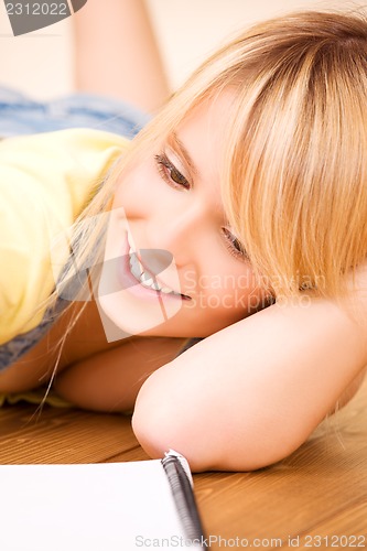 Image of teenage girl with notebook