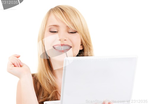 Image of teenage girl with laptop computer