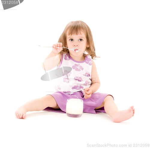 Image of little girl with yogurt