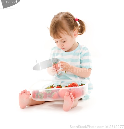 Image of little girl with strawberry