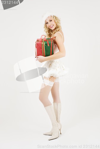 Image of cheerful santa helper girl with gift box