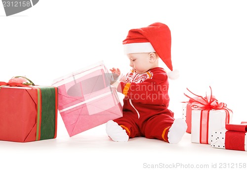 Image of santa helper baby with christmas gifts