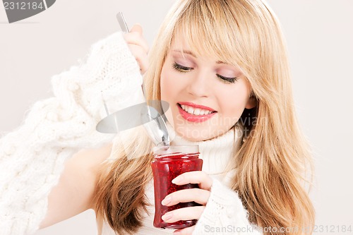 Image of happy teenage girl with raspberry jam